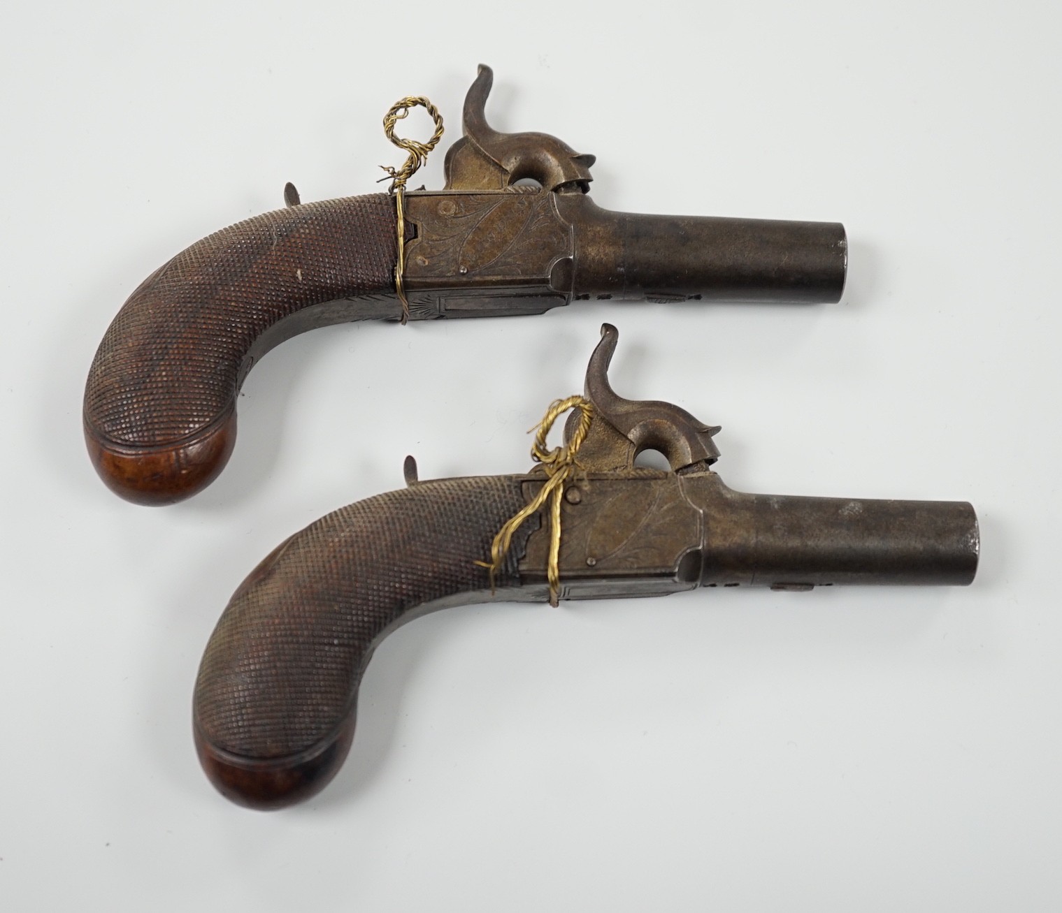 A pair of 19th century Smith of London percussion cap muff pistols, 12.5cm